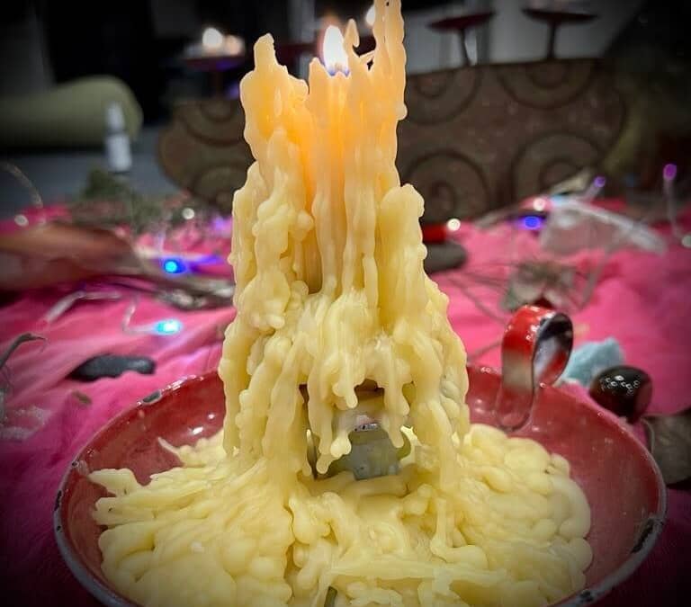 Getting Older - Image of a very old candle with lots of wax shapes from repeated use